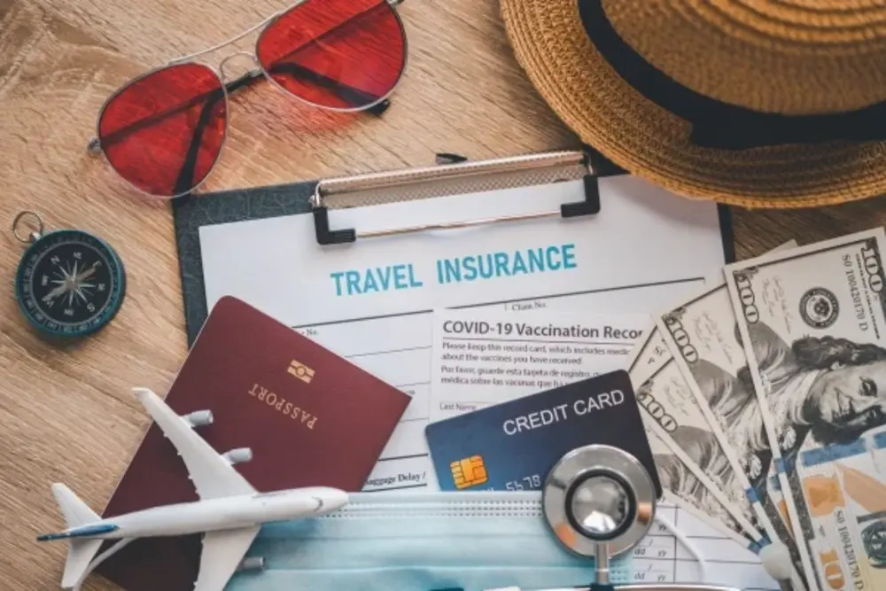 Traveler with luggage looking at airport flight board covered by travel insurance 2025